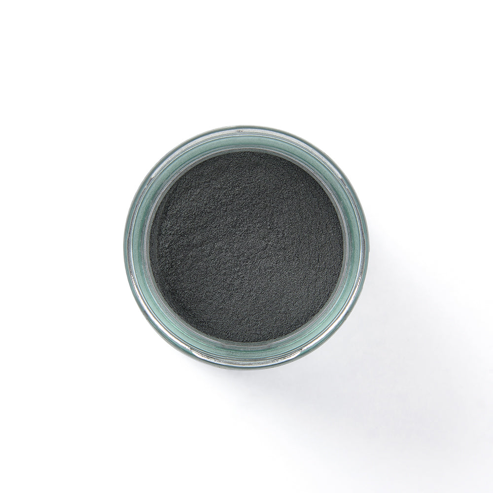 Eco Natural Toothpaste Powder in a jar with wooden spoon, featuring natural whitening ingredients and eco-friendly packaging.