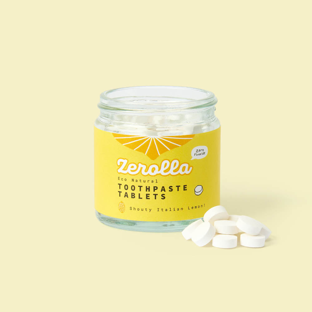 Eco natural toothpaste tablets in a plastic-free jar for zero-waste oral care