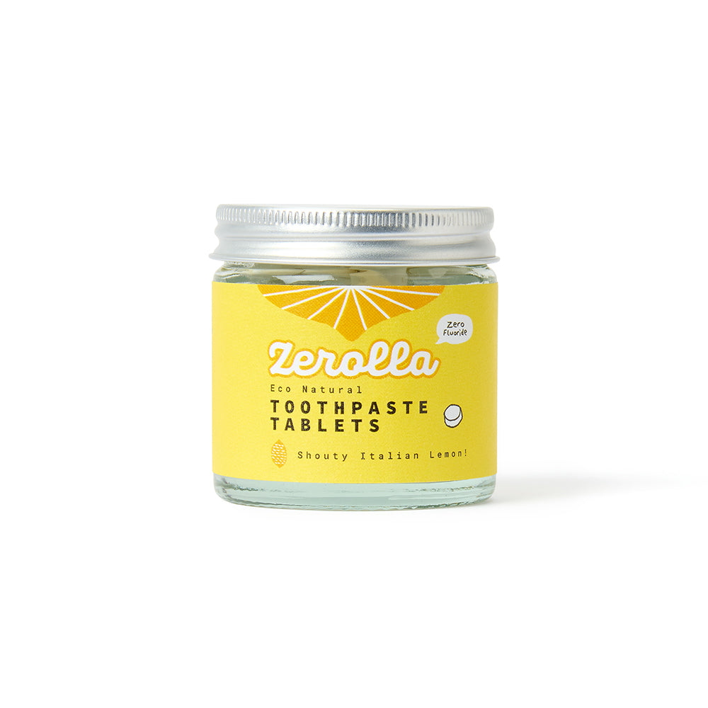 Eco natural toothpaste tablets in a plastic-free jar for zero-waste oral care