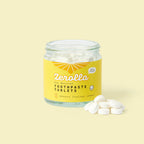 Eco natural toothpaste tablets in a plastic-free jar for zero-waste oral care