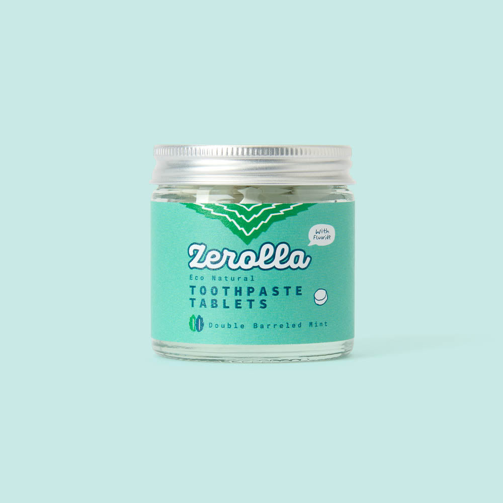 Eco natural toothpaste tablets in a plastic-free jar with whitening and plaque-removing ingredients
