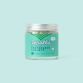 Eco natural toothpaste tablets in a plastic-free jar with whitening and plaque-removing ingredients