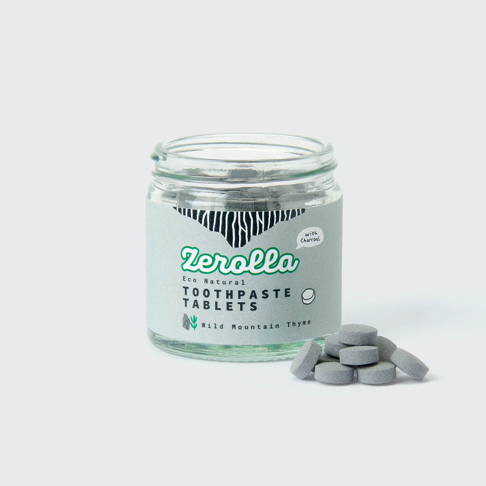 Eco natural toothpaste tablets in a plastic-free jar promoting zero waste and oral health benefits