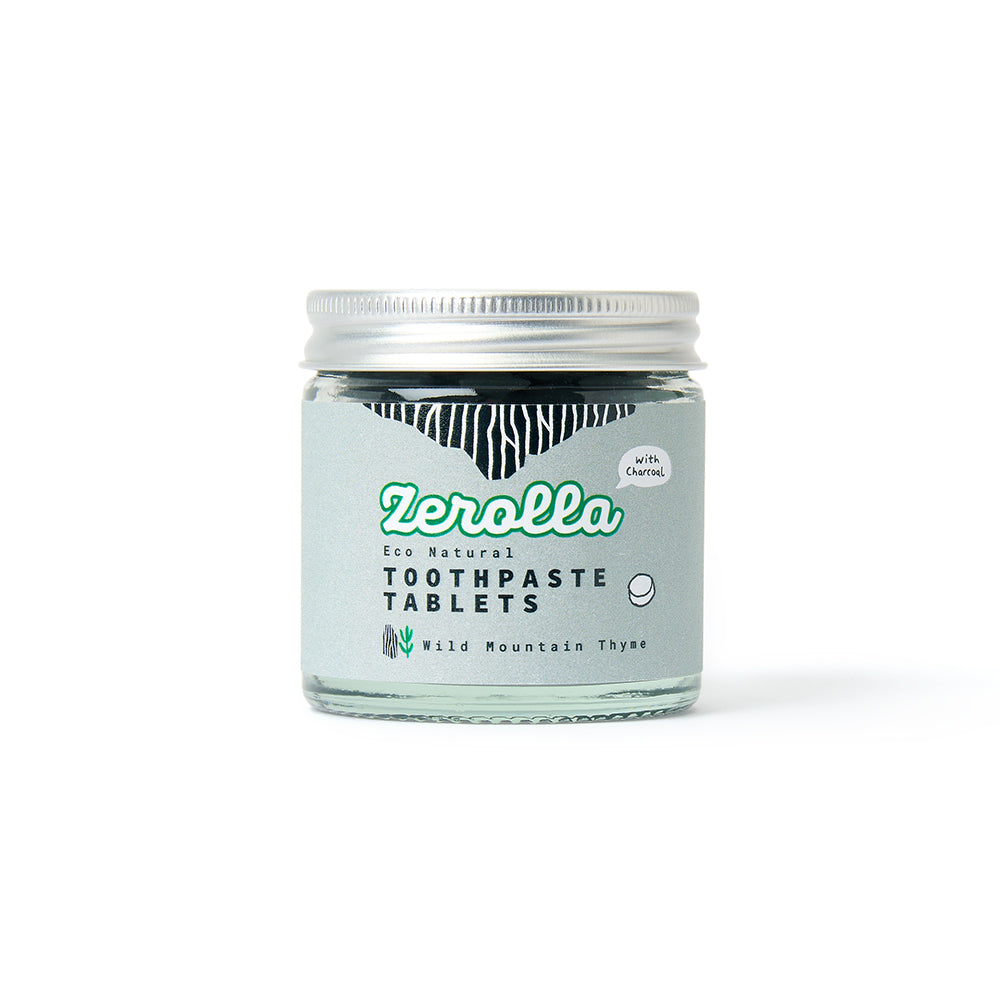 Eco natural toothpaste tablets in a plastic-free jar promoting zero waste and oral health benefits