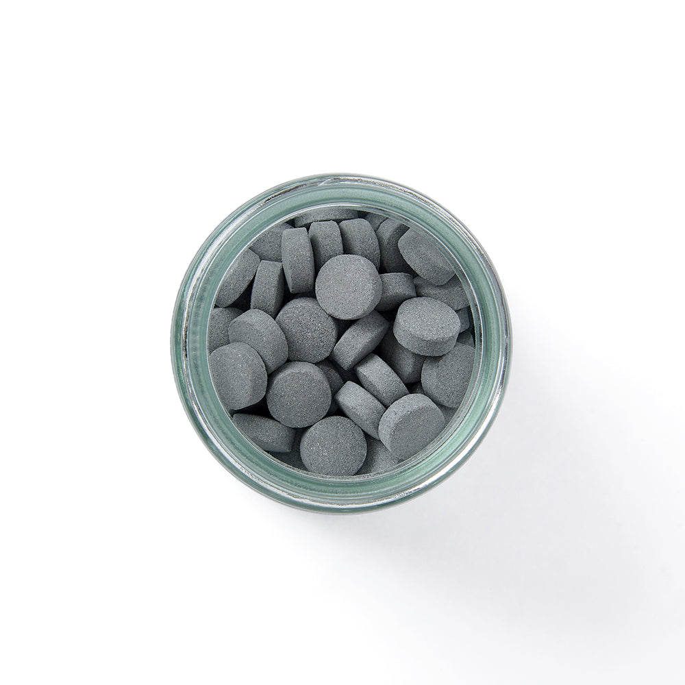 Eco-friendly Toothpaste Tablets in plastic-free packaging with whitening and plaque removal benefits