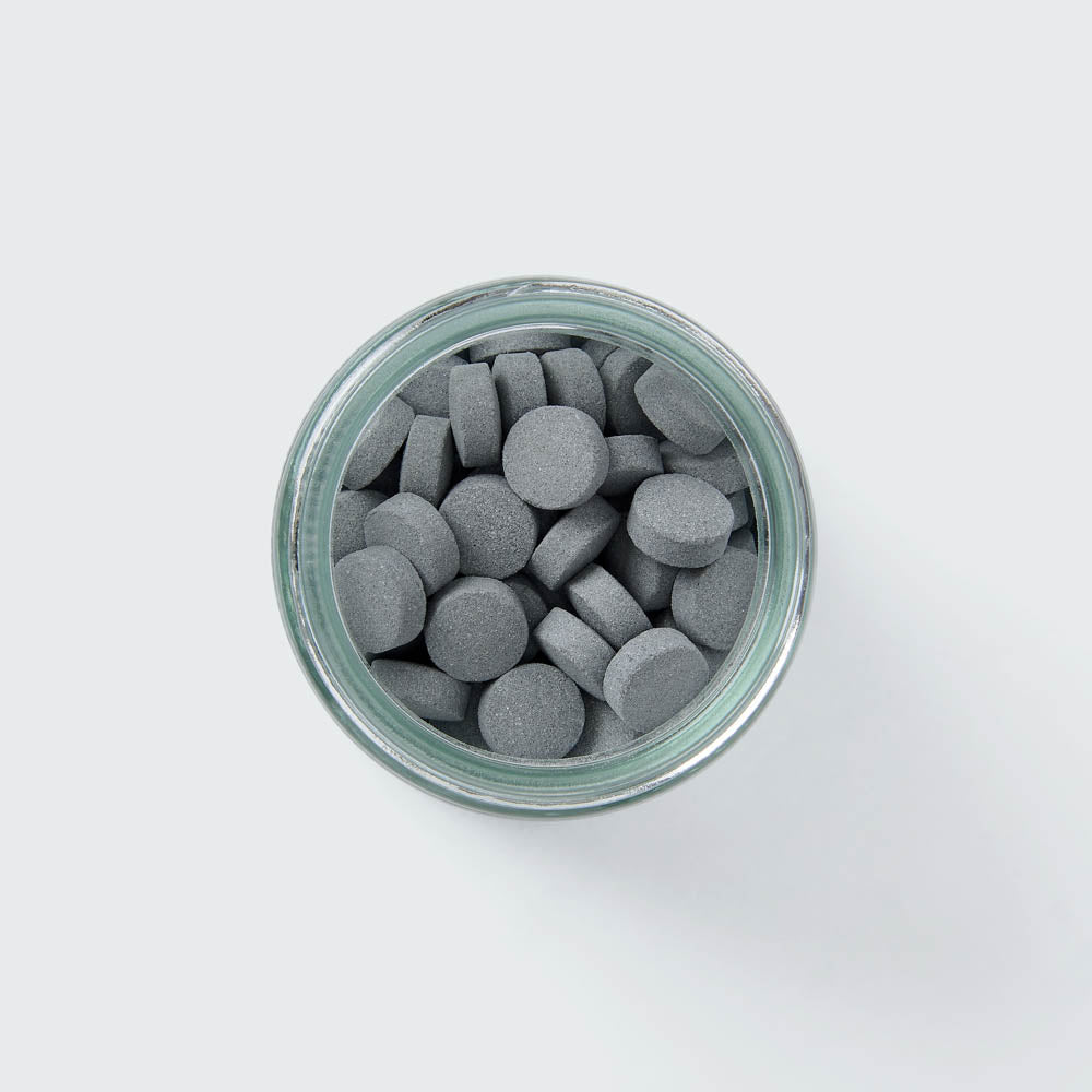 Eco-friendly Toothpaste Tablets in plastic-free packaging with whitening and plaque removal benefits