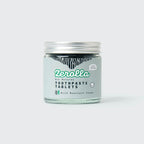 Eco-friendly toothpaste tablets in a plastic-free jar for natural oral care and whitening