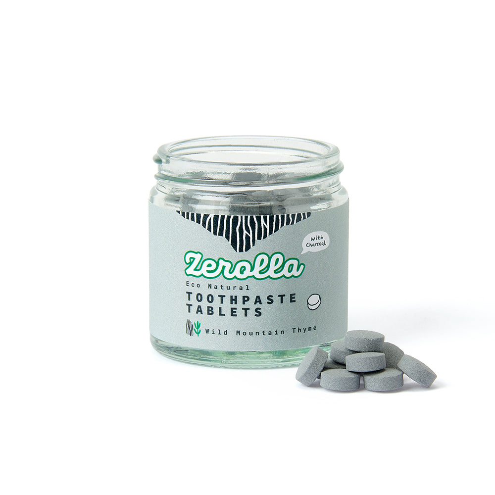 Eco-friendly toothpaste tablets in a plastic-free jar for natural oral care and whitening