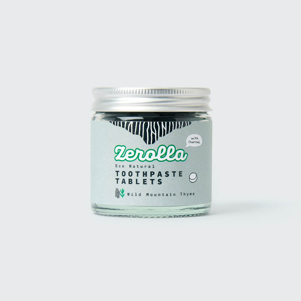 Eco-friendly toothpaste tablets in a plastic-free jar for natural oral care and whitening